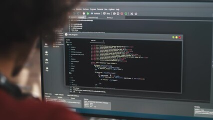 Anonymous programmer using computer for work
