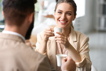 Canvas Print - Business people having coffee break in office