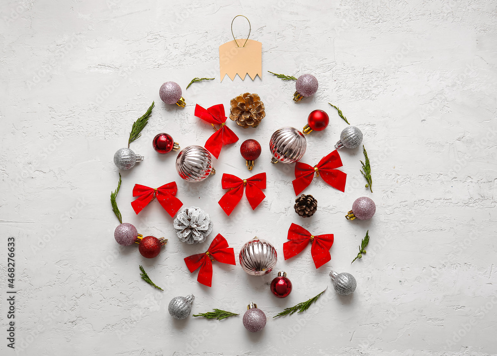 Ball made of coniferous branches and Christmas decor on white background