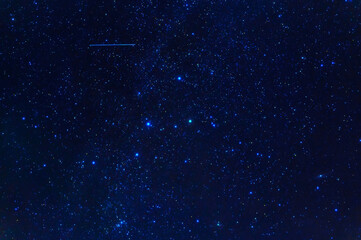 Wall Mural - constellation of Orion on background of blue starry sky. Astrophotography of stars, galaxies and nebulae at night