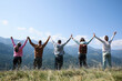© New Africa - Group of people spending time together in mountains, back view
