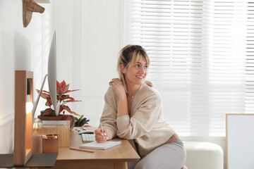 Woman at workplace in room. Interior design