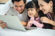 © chokniti - education at home, young mother and child family learning to work a homework with laptop