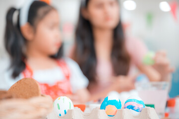 mother and child family making waster egg at home happy and fun together in holiday