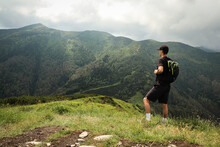 Athlete In A Black T-shirt Poses On Top Of The Mala Fatra Mountain. Climbing Mount Hromova. A Hiker