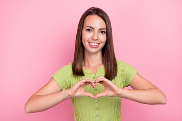 Wall Mural - Photo of young lovely lady demonstrate fingers little heart symbol love feelings isolated over pink color background