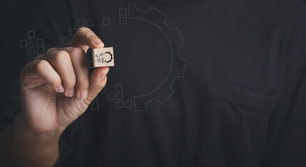 Wall Mural - hand holdding wood cube with gear digital transformation concept. connection next generation technol
