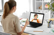 © Syda Productions - distant education, remote job and e-learning concept - female teacher with laptop computer having video call or online class with smiling student boy in headphones at home office and showing thumbs up
