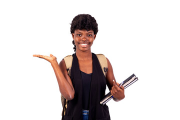 Wall Mural - beautiful young student girl showing empty palm smiling.