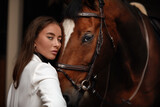 Fototapeta Konie - portrait beautiful woman long hair next horse
