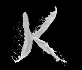 Wall Mural - Letter K made of milk splash, isolated on black background