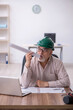 © Elnur - Old male architect working in the office