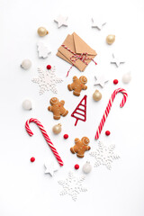 Wall Mural - Christmas decorative festive elements. Smiling gingerbread man, christmas white decorations,  Flat lay, top view.