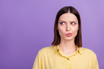 Wall Mural - Photo of young charming lady unhappy negative look empty space thoughts isolated over violet color background
