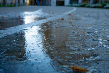 Ice On The Street. Frozen Puddle. City Centre. The First Ice On The Footpath. Slippery Footpath