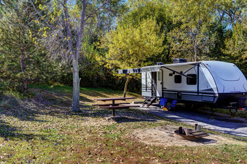 travel trailer camping in the woods at branched oak lake state park, nebraska