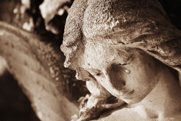 Fototapete - Crying angel. Tears on his face as symbol of death, pain and fear. Fragment of an ancient statue.