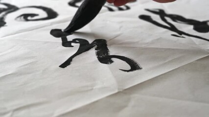 Wall Mural - an old calligrapher is writing calligraphy and writing calligraphy