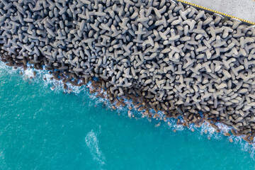 Sticker - Top down view of the wave breaker over the sea