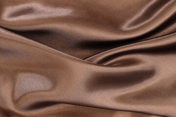 Wall Mural - Brown satin fabric texture for background and design art work, beautiful crumpled pattern of silk or linen.