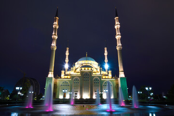 Wall Mural - Night fountain against the background of the Heart of Chechnya mosque. Grozny, Chechen Republic