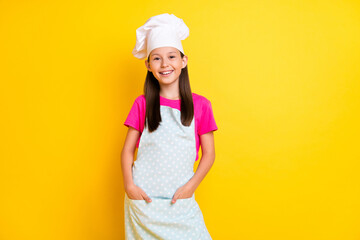 Poster - Photo of confident nice girl hands pockets finish dinner wear white apron hat isolated yellow color background