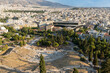 The ancient greek Theater of Dionysus (or Theater of Dionysos) is built on the south slope of the Acropolis hill. The new modern Museum of Acropolis and the Attica Basin in the background. Sunny day