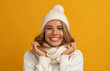 © mary_markevich - young smiling happy pretty blond woman wearing white knitted sweater, scarf and hat