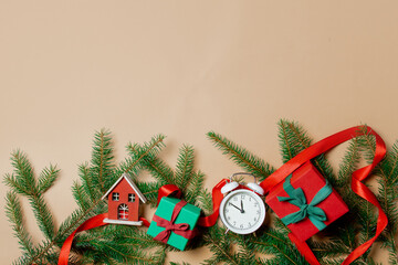 Wall Mural - Holiday gift boxes with spruce branches and alarm clock