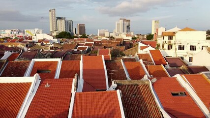 Poster - Malacca aerial view at sunset. Sky colors over Melaka city skyscrapers