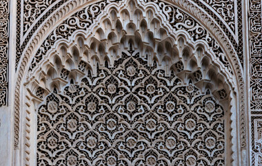 gorgeous moroccan arabesque architecture in bahia palace - engraved walls, lace motif