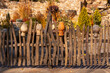 Clay jugs on a wooden fence in Loga Park. Kamensk-Shakhtinsky. Rostov region. Russia.