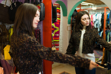 Wall Mural - Caucasian woman trying on clothes