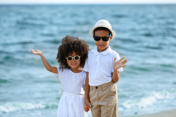 Poster - African-American brother and sister on sea beach