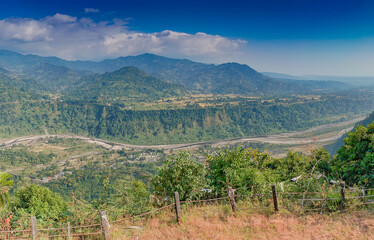 Panoramic image of India Bhutan border at Jhalong , Dooars - West Bengal , India