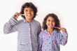 © IndiaPix - Portrait of Sibling brushing teeth together with toothbrush