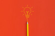 Light bulb on red background. Inspiration and creative idea concept. Top view with copy space. Flat lay composition.