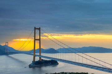 Wall Mural - modern suspension bridge in sunset