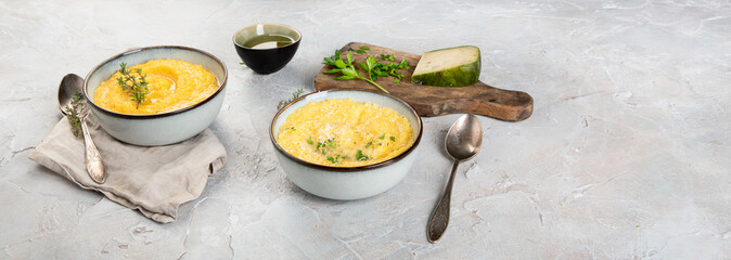 Wall Mural - Corn polenta on gray background.