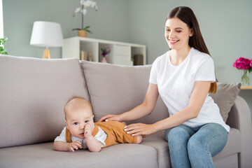 Poster - Photo of cheerful dreamy babysitter mom play little son sit comfy sofa wear casual outfit home indoors