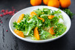 © Alesia Berlezova - salad citrus lettuce, mix leaves, tangerine or orange meal snack on the table copy space food background rustic. top view keto or paleo diet veggie vegan or vegetarian food