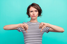 Photo Of Young Girl Unhappy Upset Show Thumb-down Bad Quality Dislike Isolated Over Teal Color Background