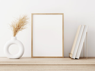 Poster - Empty vertical frame mockup in warm neutral minimalist interior with dried pampas grass in trendy donut vase and books on white wall background. Illustration, 3d rendering