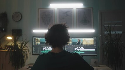 Wall Mural - video editor working remotely from home