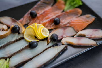 assorted appetizer pieces of fish on a plate