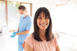 © Wavebreak Media - Portrait of smiling caucasian female patient looking at camera at modern dental clinic