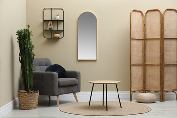 Sticker - Stylish living room interior with mirror and comfortable armchair