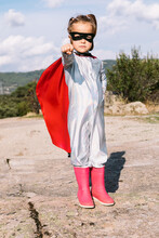 Brave Kid In Superhero Costume Showing Fists