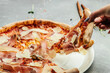 Homemade pizza with tomato sauce, parmesan cheese, Parma ham, Restaurant menu, dieting, cookbook recipe