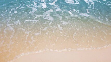 Wall Mural - Top view of beautiful Sandy coastline with white turquoise sea waves.